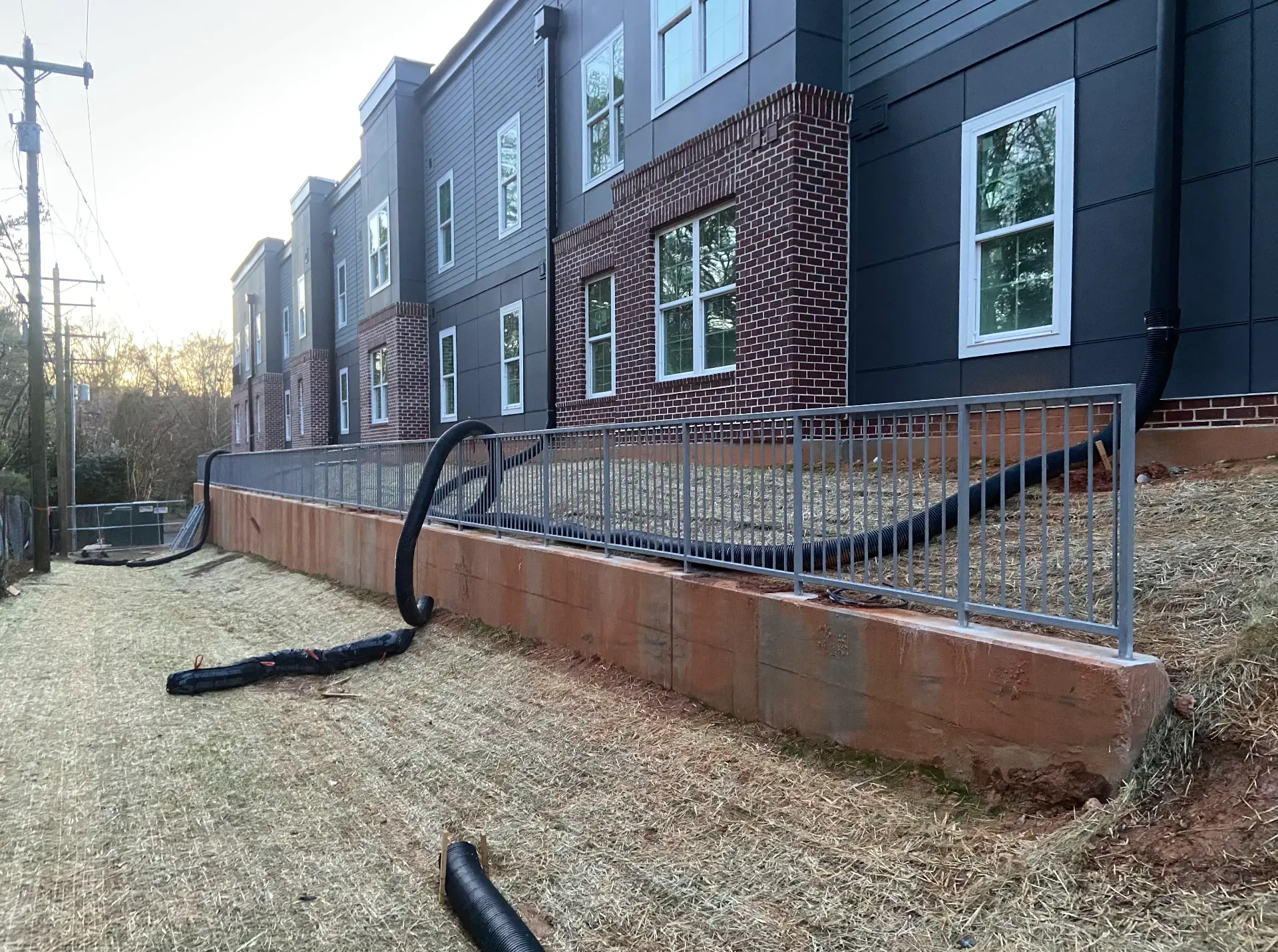 Steel guardrail along a retaining wall